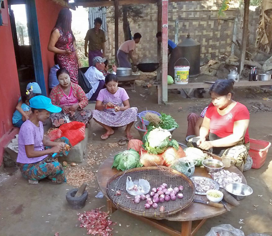 Buddhist ladies preparing food for Christmas