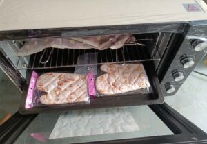 Portable oven with the door open.